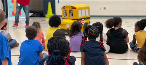 Buster the bus with students